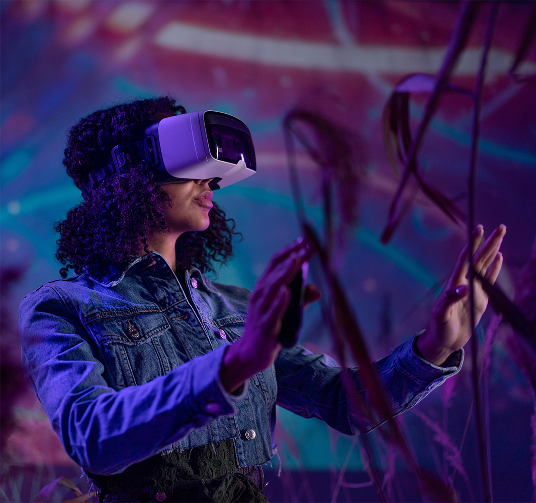 Person wearing a VR headset exploring futuristic virtual reality technology and digital innovation.